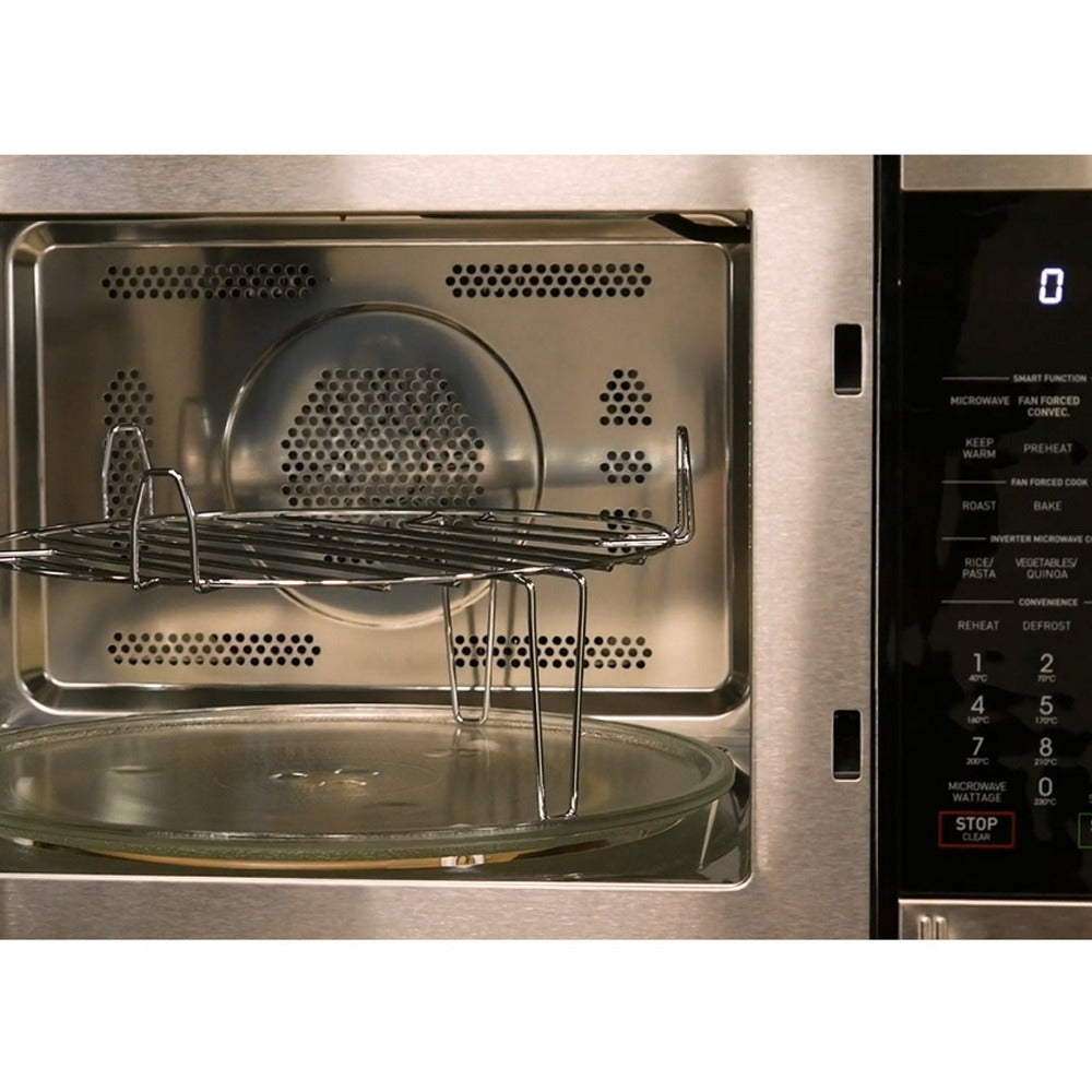 Stainless steel microwave with glass tray and metal rack inside